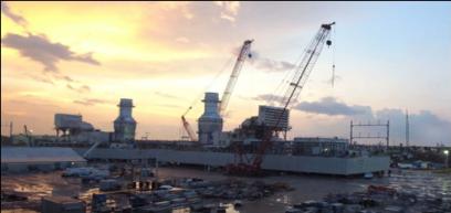Image of barge mounted GE 7FA gas turbine power barges being built in Signal International's Orange Shipyard